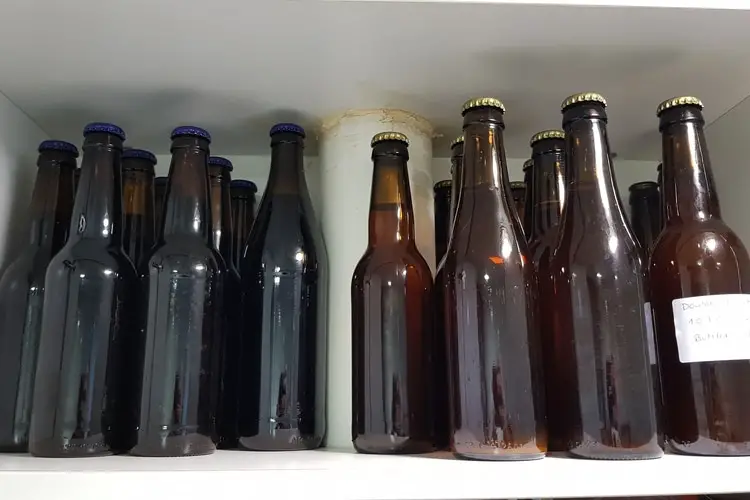 homebrews in a dark cupboard